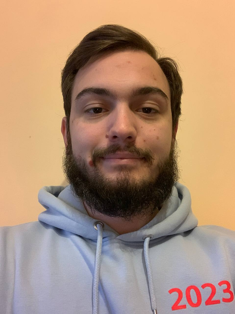 A person taking a selfie

Description automatically generated